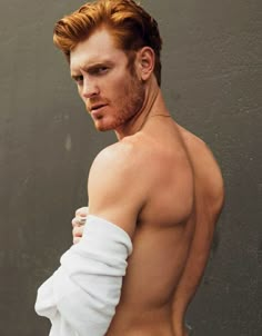 a man with red hair and no shirt on