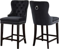 pair of black velvet bar stools with button tufted back and nail polishing