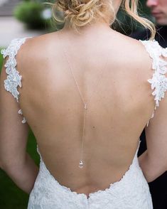 the back of a bride's wedding dress