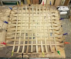 a table made out of plywood and plastic pegs on top of wood planks