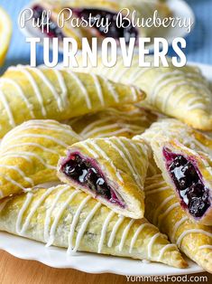 puff pastry blueberry turnoverers on a white plate