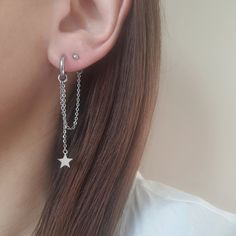 Double piercing earring. Huggie hoop earring with chain and a star charm and a ball stud earring. Ball stud size: 3mm They are edgy, modern and perfect for every day wear or special ocassion and a night out. MATERIAL Surgical grade stainless steel: ▪ Rarely causes allergic reactions, ▪ does not tarnish, stain or fade ▪ does not rust or corrode, ▪ does not change color, ▪ does not turn your skin green, ▪ it requires little to no maintenance, ▪ it is much more durable than silver or platinum, It w Silver Lobe Earrings, 2 Earrings In One Ear, Earrings For Double Piercings, Silver Piercings With Star Charm As Gift, Double Earings Piercings, Two Lobe Piercings, Trendy Sterling Silver Dangle Piercings, Chain Earring, Doubles Piercings