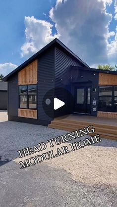 a black house with the words head turning modular home