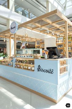 the inside of a deli with lots of food on display