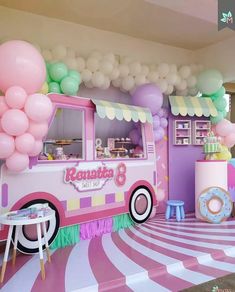 an ice cream truck decorated with balloons and streamers for a birthday party or baby shower