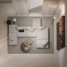 an overhead view of a living room with white furniture