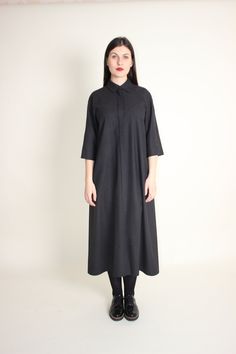 Elegant wool long maxi shirt dress  is a simple and classic autumn and winter dress.  This minimalist, modest dress is handmade from warm wool and is perfect for casual wear or for office, you will always look elegant and feel warm.  This fashionable, practical A-line dress with raglan cut sleeves and side seam pockets is very comfortable and easy to wear. You can wear it loose or with any belt you have for more defined shape.  DRESS DETAILS: - Fabric: 100% wool.  - Color: black grey stripes. ( You can choose a different color). Please note that actual colors may vary due to your computer monitor settings. - Wash & Care: recommended professional dry cleaning.  Hand wash in warm water (max 30-40 degrees), do not bleach, soak or tumble dry. Turn inside out before washing. Iron inside out on Classic Long Dresses For Fall, Classic Long Fall Dresses, Long Shirt Dress For Daywear In Fall, Long Shirt Dress For Fall Daywear, Winter Workwear Midi Length Shirt Dress, Winter Workwear Midi Shirt Dress, Winter Midi Length Shirt Dress For Workwear, Classic Shirt Dress For Fall With Placket, Winter Cotton Midi Dress For Work