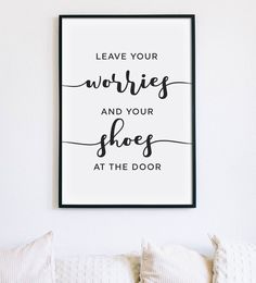 a black and white poster with the words leave your worries and your shoes at the door