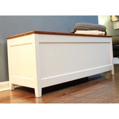 a white bed frame with wooden slats on top