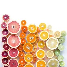 an assortment of citrus fruit cut in half