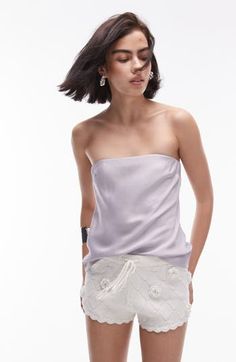 Whether you're headed for a night out or meeting friends for brunch, you'll love rocking this sleek strapless top made from slinky satin and cut in a longline silhouette. Strapless 100% viscose Machine wash, line dry Imported Summer Evening Tops With Straight Neckline, Summer Tops For Night Out With Straight Neckline, Summer Tops With Straight Neckline For Night Out, Glamorous Summer Tube Top With Spaghetti Straps, Chic Strapless Camisole For Party, Chic Strapless Camisole, Glamorous Tube Top With Spaghetti Straps For Summer, Bandeau Tube Top For Night Out In Spring, Spring Bandeau Tube Top For Night Out