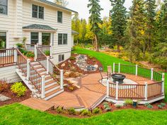 a deck with steps leading up to a house