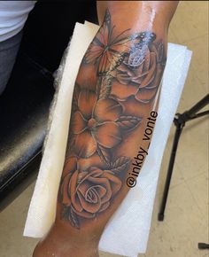 a person with a flower tattoo on their leg