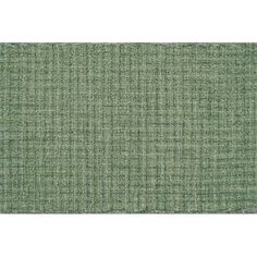 a green rug with small squares on the bottom, and an area that has been made from