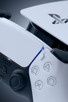 an image of a video game console with two controllers on the front and one controller in the back