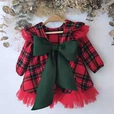 Flannel cloth dress with red and green tartan for babies, with red tulle ruffles and green bow with a matching diaper cover with tulle ruffles to match the dress, a perfect set for Christmas, typical Christmas photo shoot. We make it in any color you need, you can choose any modification you like just talk to me. It is the perfect gift for toddlers and newborns. Ideal garments for fun moms or to make a very special gift. You will find many assorted items in the store, you decide to compose your Christmas Plaid Dress Baby, Toddler Plaid Christmas Dress, Tartan Baby Dress, Baby Girl Christmas Dress, Baby Christmas Dress, Tulle Ruffles, Christmas Dress Baby, Green Tartan