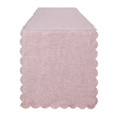 a pink table runner with scalloped edges