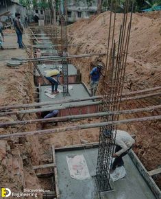 construction workers are working on the foundation of a building