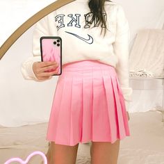 50% Cotton 48% Polyester 2% Spandex Pink pleated tennis skirt Built in shorts under Size and Fit: Model height 5’2” wearing size Small