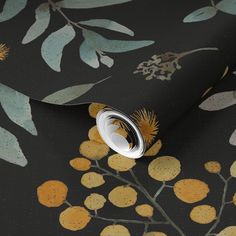 a black wallpaper with yellow and green leaves on the background, it looks like something from another era