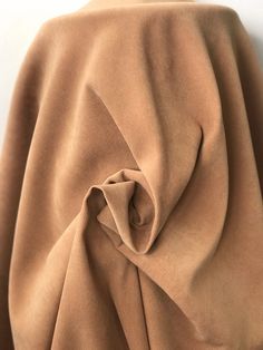 Suede look stretch fabric satin back. 100% polyester. Pillows Black, Duchess Satin, Faux Suede Fabric, Suede Fabric, Silk Embroidery, Polyester Satin, Camel Color, Wool Jacket, Soft Suede