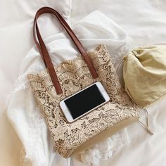 Every gal needs a lightweight, small Summer-vibe handbag! Just a dainty little thing that you can take with you on your minimalist getaway! This handbag will fit all your essentials and pair perfectly with all your stylish vacation or Summer outfits! Crochet Lace Shoulder Tote Bag available in Beige or White Bag Dimensions: 12" H x 5" W x 11" L 2 Straps: 23" each end to end Strap Drop: 9" Magnetic Snap Closure Chic Portable Shoulder Bag For Vacation, Vacation Shoulder Bag For Mobile Phones, Summer Travel Portable Shoulder Bag, Chic Vacation Shoulder Bag With Mobile Phone Bag, Chic Shoulder Bag With Mobile Phone Bag For Vacation, Trendy Beige Handheld Canvas Bag, Trendy Cream Shoulder Bag For Vacation, Trendy Beige Beach Bag For Travel, Trendy Beige Canvas Bag