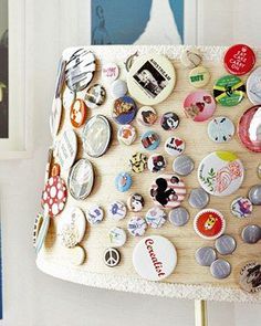 a lamp shade covered in many different types of buttons