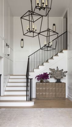 22 Best Neutral Paint Colors, According to Scouted Experts | The Scout Guide Chandelier In Stairwell, Foyer Paneling, Staircase Lights, Staircase Lighting Ideas, Best Neutral Paint Colors, Stairs Decor, Entryway Stairs, Stairway Lighting, Scout Guide