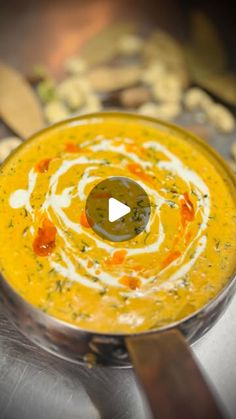 a bowl filled with soup sitting on top of a table