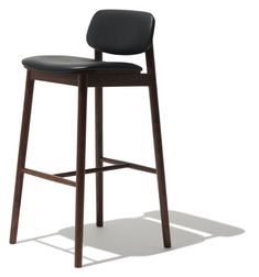 a wooden stool with black leather upholstered seat on an isolated white background,