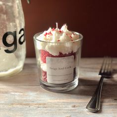 a glass cup filled with red and white cake