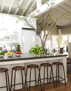 a kitchen with an island and bar stools