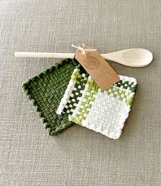 two green and white crocheted dishcloths with wooden spoon