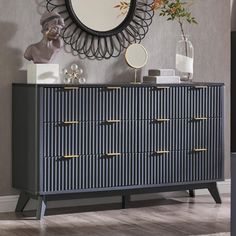 a dresser with drawers and a mirror on the wall above it in a living room