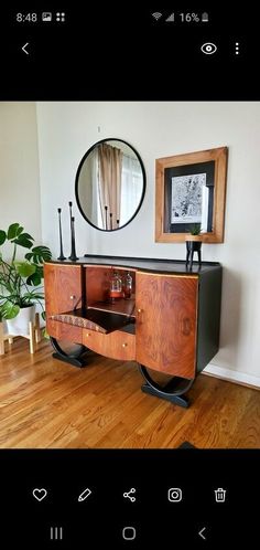 an old dresser has been converted into a modern sideboard with drawers and mirrors on it