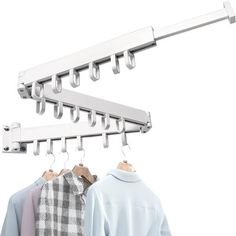 two shirts hanging on clothes rails and one has a coat hanger attached to it