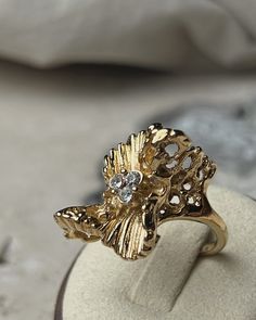 Vintage Abstract Gold Cocktail Ring Elegant Gold Diamond Ring, Elegant Gold Flower Metal Ring, Metal Rings With Diamond Accents For Gift, Metal Rings With Diamond Accents As Gift, Metal Open Ring Diamond Ring For Anniversary, Elegant Metal Rings With Diamond Accents, Gold Diamond Ring With Rhinestones, Gold Cubic Zirconia Butterfly Ring For Formal Occasions, Formal Gold Cubic Zirconia Butterfly Ring