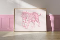 a pink and white drawing of a tiger on a wall in a room with hardwood floors