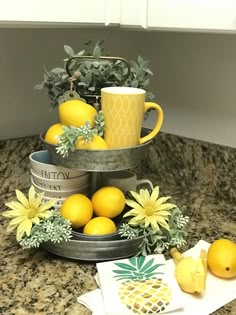 three tiered tray with lemons and coffee cups