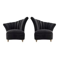 two black velvet chairs with wooden legs