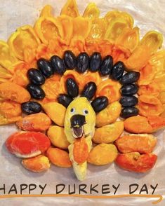 a turkey made out of fruits and vegetables with the words happy durkey day written on it