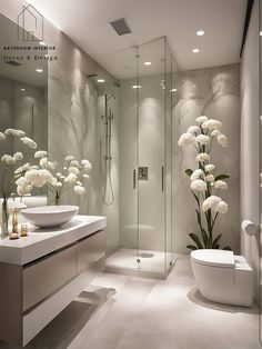 a modern bathroom with white flowers on the counter