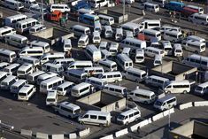 many buses are parked in a parking lot