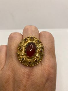 Vintage red carnelian golden bronze ring Lovely vintage golden bronze setting Size 8 My jeweler would re size for $20 fee All rings are shipped in a nice gift box. Check out our over a THOUSAND great reviews Engraving is $4 per letter and is not always perfect depending on the piece. It can take a few days if the jeweler is busy. This is payable to Paypal Judithsltd@gmail.com Victorian Cabochon Rings As Gifts, Victorian Cabochon Rings For Gift, Victorian Cabochon Rings As A Gift, Vintage Cabochon Rings For Gifts, Vintage Cabochon Rings As Gift, Victorian Red Oval Cabochon Jewelry, Red Vintage Jewelry With Cabochon, Antique Oval Red Ruby Ring, Antique Red Brass Jewelry