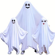 two white ghost costumes with black eyes and mouths are standing in front of each other