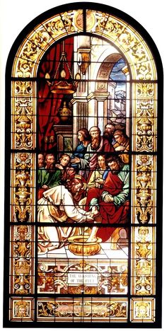 a stained glass window depicting the birth of jesus