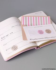 an open notebook with stickers on the pages and a notepad in front of it