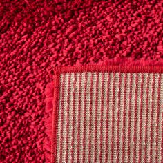 a red and white rug on the floor