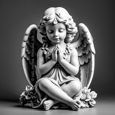 an angel statue sitting on top of a table