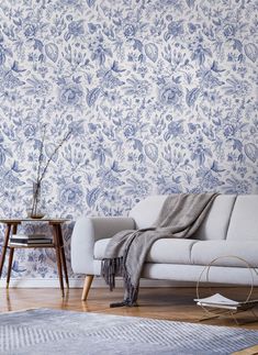 a living room with blue and white wallpaper